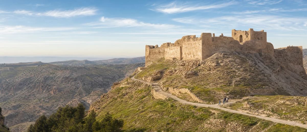 Shobak Castle ruins standing alone on a rocky hilltop surrounded by desert landscape